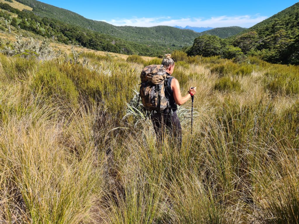 girl walking through tussock